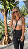  Beautiful model wearing AMY TAYLOR x HITCHED - Rhea Crossbody Strap, by Amy Taylor Collection. Contact us today to order your perfect outfit. 1 