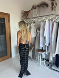  Beautiful model wearing Alina Top (Black), by Amy Taylor Collection. Contact us today to order your perfect outfit. 1 